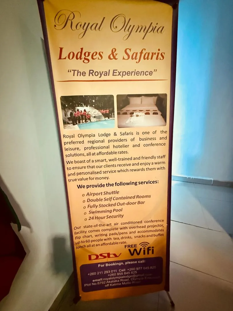 Royal Olympia Lodges & Safaris signage at the property entrance
